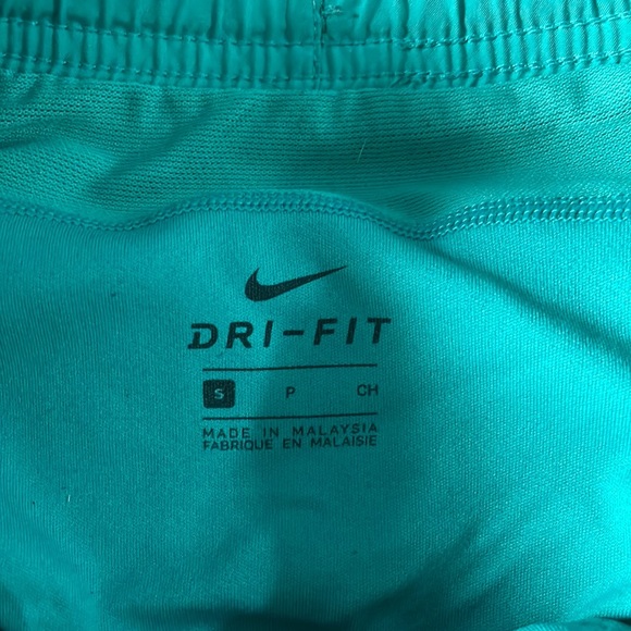Teal nike shorts with pocket in back, small stain on right side - Picture 3 of 4